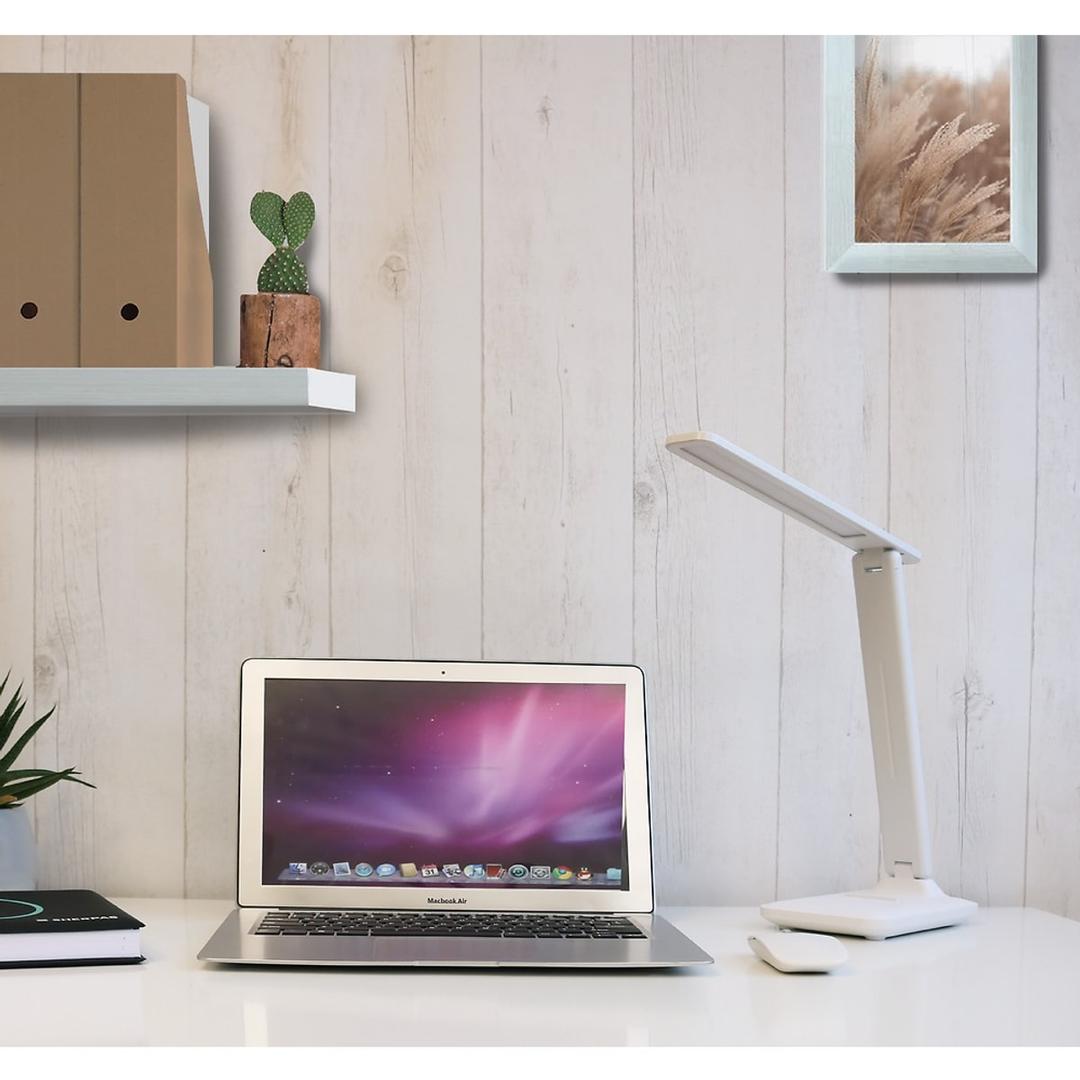 Lampe de bureau LED pliable, rechargeable HALO UNILUX - Lampe de bureau LED UNILUX HALO sur un bureau avec un ordinateur portable