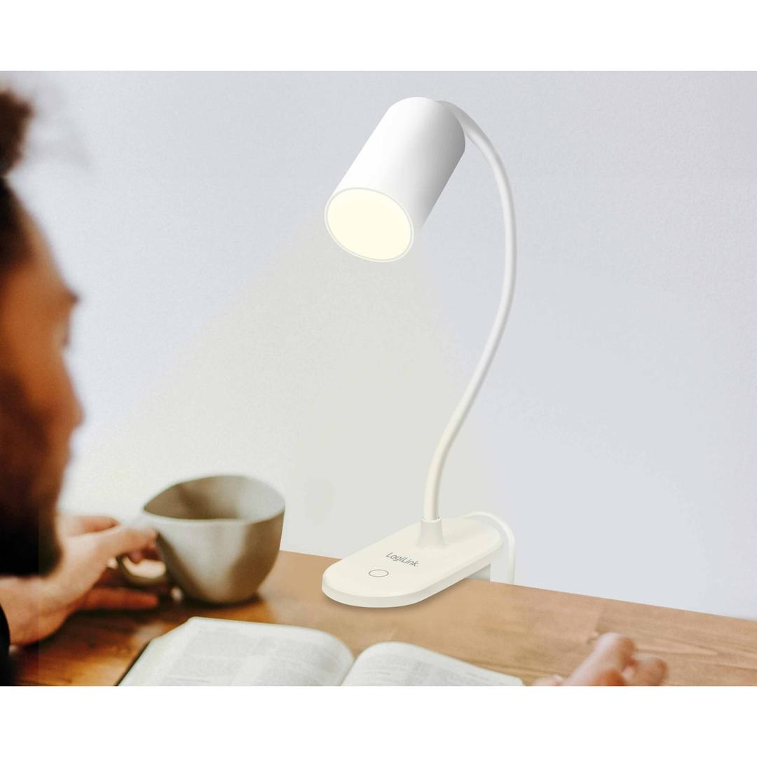 USB, blanche Lampe de lecture LED à pince LOGILINK - Lampe de lecture LogiLink LED024 allumée au-dessus d'un livre ouvert