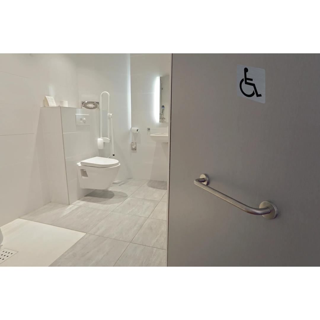 Plaque Handicapés EXACOMPTA collée sur une porte de toilettes