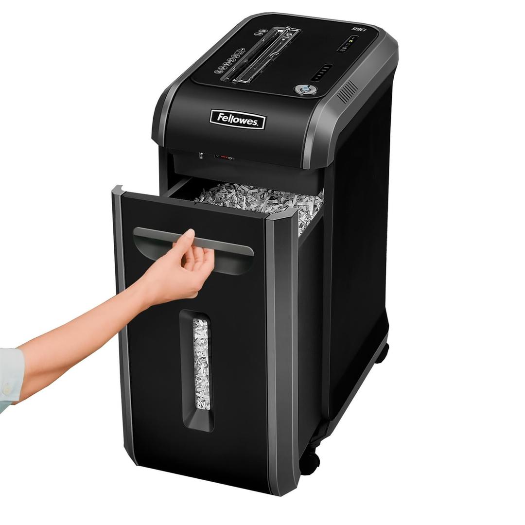 Ouverture du bac de récupération (34 L) du destructeur Fellowes Powershred 99Ci montrant les confettis 4x38 mm.
