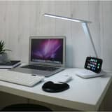 Lampe de bureau LED pliable, rechargeable HALO UNILUX - Lampe de bureau LED UNILUX HALO avec un smartphone posé sur le socle