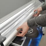 Tirage posé sur la table avant la coupe, coupeuse électrique NEOLT Electro Trim 150