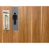 Plaque Homme EXACOMPTA collée sur une porte