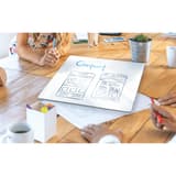 Tableau blanc nobo Frameless Modular décroché et posé sur une table