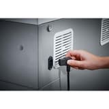 Destructeur DAHLE 519 : flanc avec grille de ventilation et branchement du cordon secteur